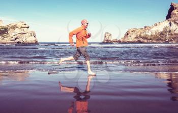 Running man in ocean coast