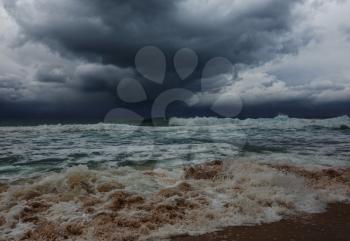 storm clouds and dramatic waves in ocean