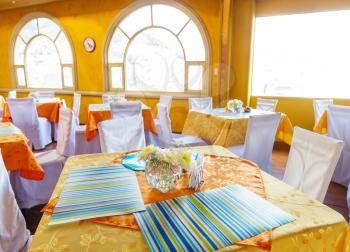 Restaurant interior in yellow and orange design