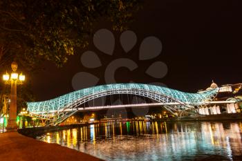 Bridge of Peace, modern pedestrian bridge over the Mtkvari River in the center of Tbilisi at  night