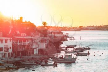 A colonial fishing town in Mexico at sunset