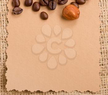 Royalty Free Photo of a Piece of Paper and Coffee Beans