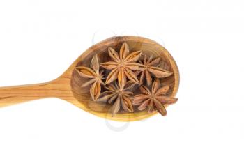 Star anise in wooden kitchen spoon