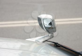 Automobile rear-view mirror attached on a cowl