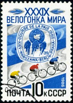 USSR - CIRCA 1986: a stamp printed by USSR, shows bicyclists and emblem. World Cicle Race , circa 1986