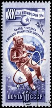 RUSSIA - CIRCA 1977: Stamp printed in USSR (Russia), shows astronaut in open space, with inscription and name of series 20 years of a space age, circa 1977