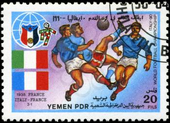 YEMEN - CIRCA 1990: stamp printed by Yemen, shows soccer players and ball, circa 1990.