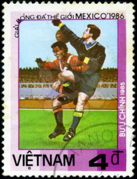 VIETNAM - CIRCA 1985: a stamp printed by VIETNAM shows football players. World football cup in Mexico 1986, circa 1985