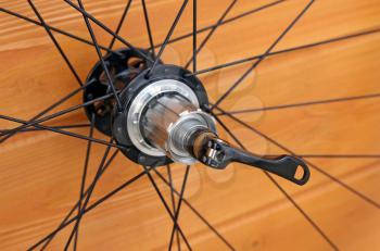 bike rear wheel against brown background