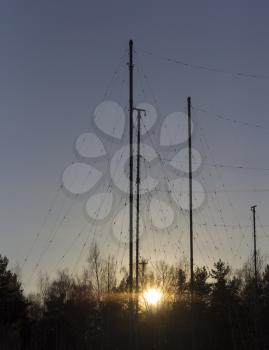 Silhouette Antenna against the sky at sunrise.