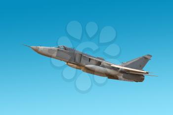 Military jet bomber Su-24 Fencer flying a blue background.