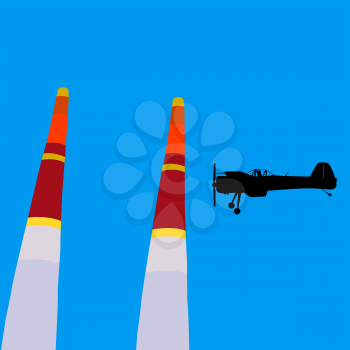 Aerobatic aircraft performs aerobatics against the sky.