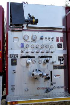 Royalty Free Photo of a Firetruck Hose With Gauges