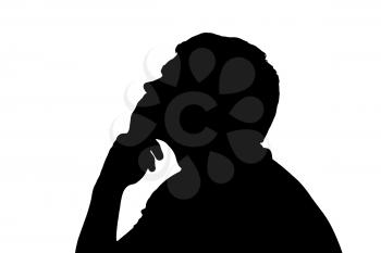Side profile portrait silhouette of a teenage boy thinking finger on lips