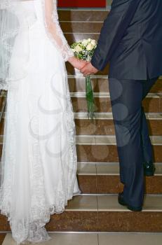 groom and fiancee rising on steps