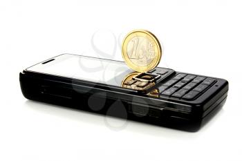 mobile telephone and coin 1 euro isolated on white background
