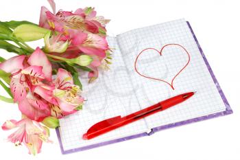 notebook with a pen by flowers and heart isolated on white background