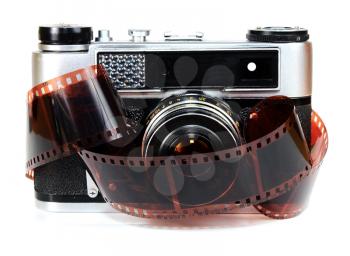old retro photo camera and film isolated on white background