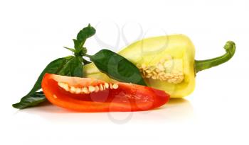 red and yellow cut pepper and green leaf isolated on white background
