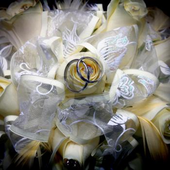 wedding rings and bouquet from bride