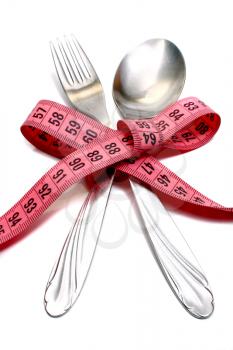 spoon and fork is strung by a ribbon for measuring diet isolated on white background