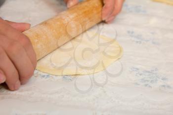 woman hands knead dough 