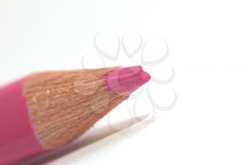 pink pencil on a white background. macro