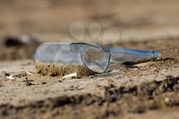 broken glass bottle in the sand