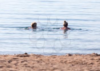 girl bathes on the beach