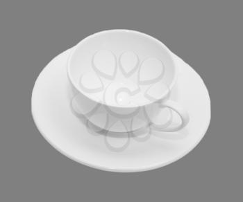 White mug and saucer on a gray background.