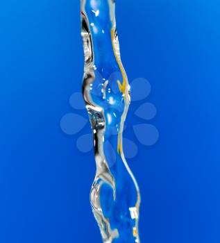 a jet of water on a blue background
