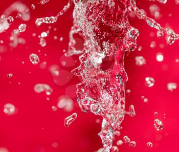 spray water on red background