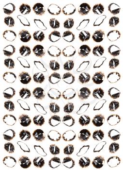 Collection of burnt holes in a piece of paper isolated on white background 