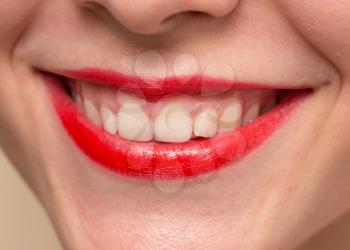 Smiling female red lips and healthy white teeth closeup shot with