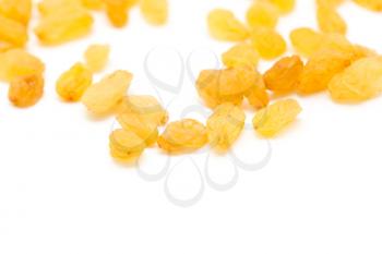 Golden raisins on a white background