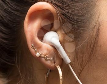 White earphone in the ear