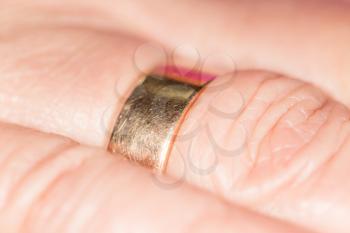 gold ring on her finger