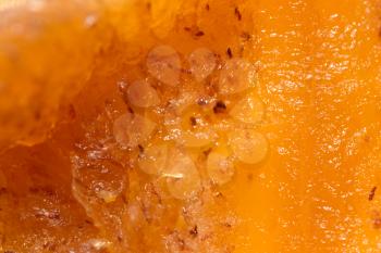 pulp ripe persimmons as a background. macro