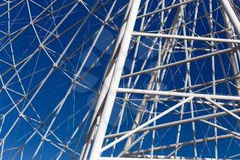 metal Ferris wheel against the blue sky