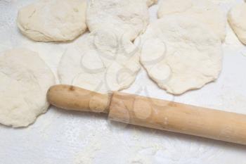 rolling dough with a rolling pin
