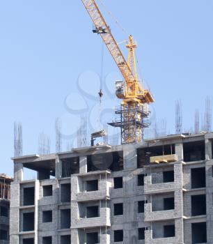 Crane building a multi-storey building