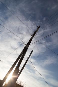 Electric poles at sunset