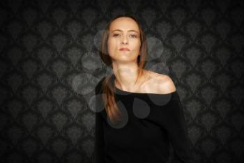 Fashion girl with retro black and white wall-paper