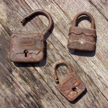 Old wooden padlocks on wooden background