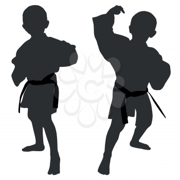 Silhouettes of two little boys who playing karate