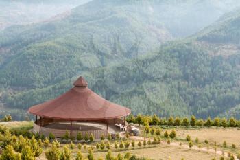 Royalty Free Photo of an Arbor With a Round Roof in the Mountains