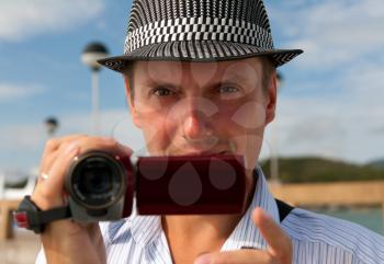 Royalty Free Photo of a Man Holding a Video Camera