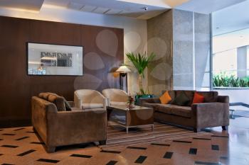 brown sofas and coffee table in the lobby