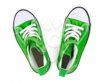 Green sneakers on a white background. Top view