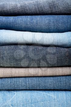 stack of blue jeans background colors